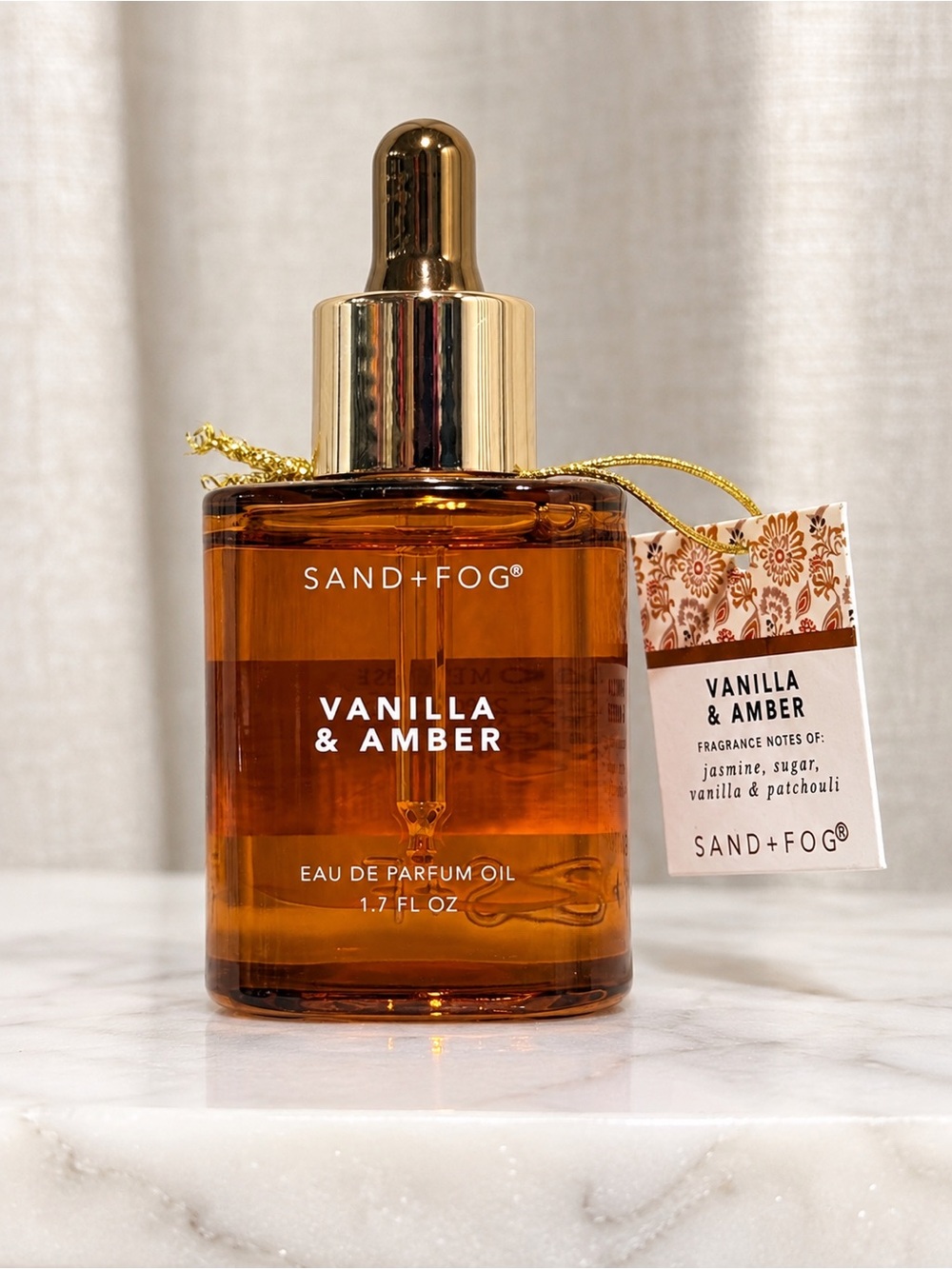 Sand + Fog Vanilla & Amber fragrance oil in a 50 mL / 1.7 fl oz dropper bottle.